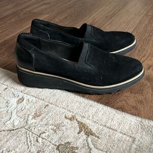 Clark’s black loafers